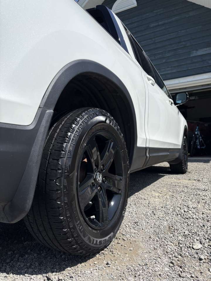 Clean white Honda Pilot after a full exterior detail