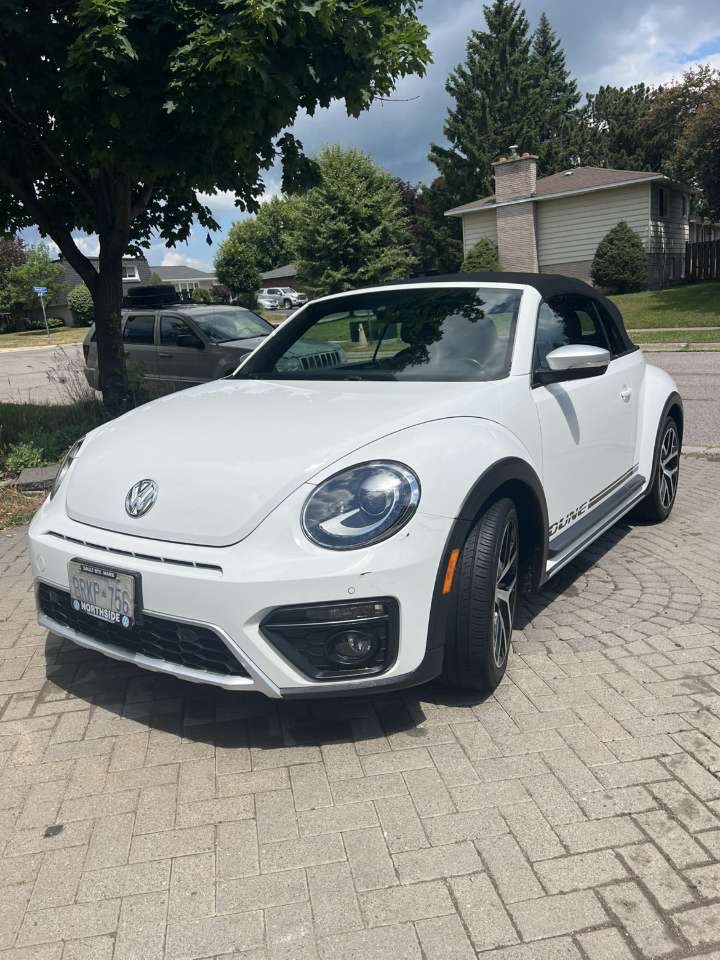 White Volkswagen Beetle convertible after detailing