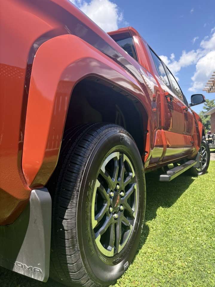 Freshly detailed orange Toyota Tacoma with deep gloss paint